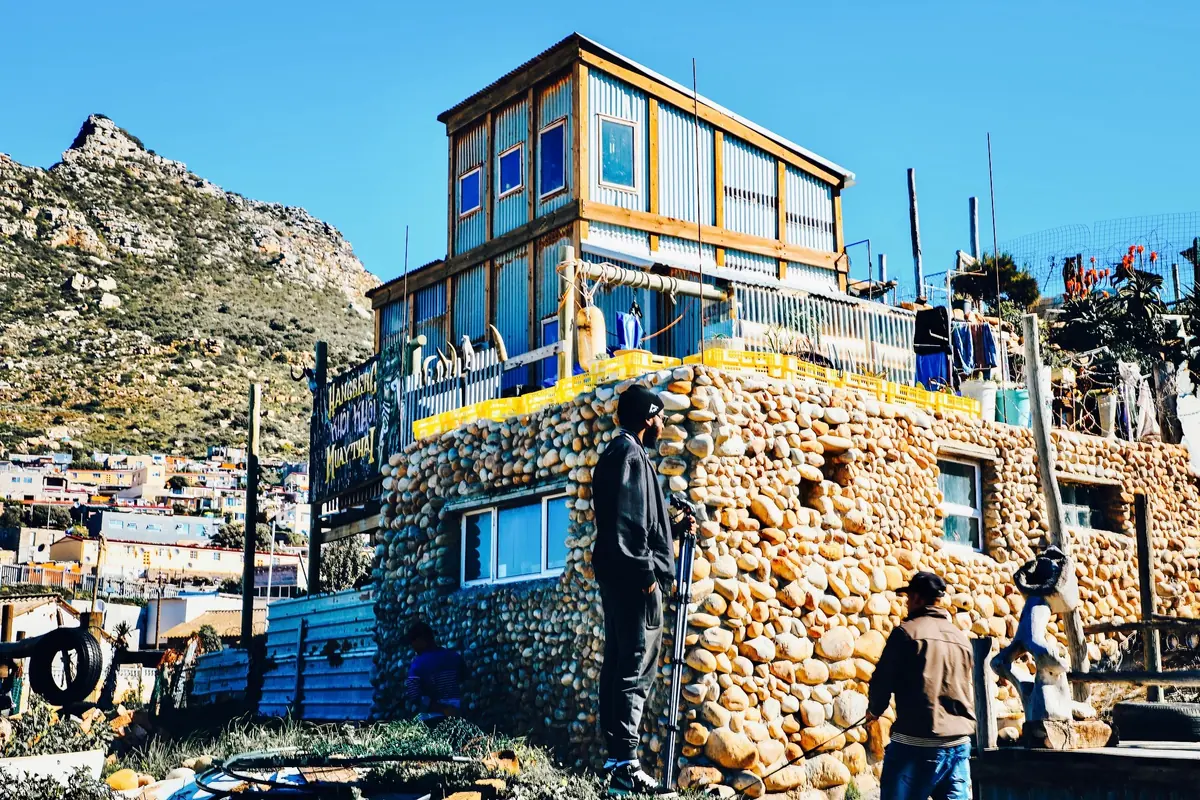 A self-built home of stone and salvaged timber on the hillside above Hout Bay